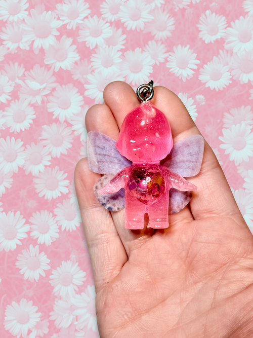 Adorrible Butterfly Kewpie Keychain featuring a cute butterfly and Kewpie doll design, attached to a metal key ring.