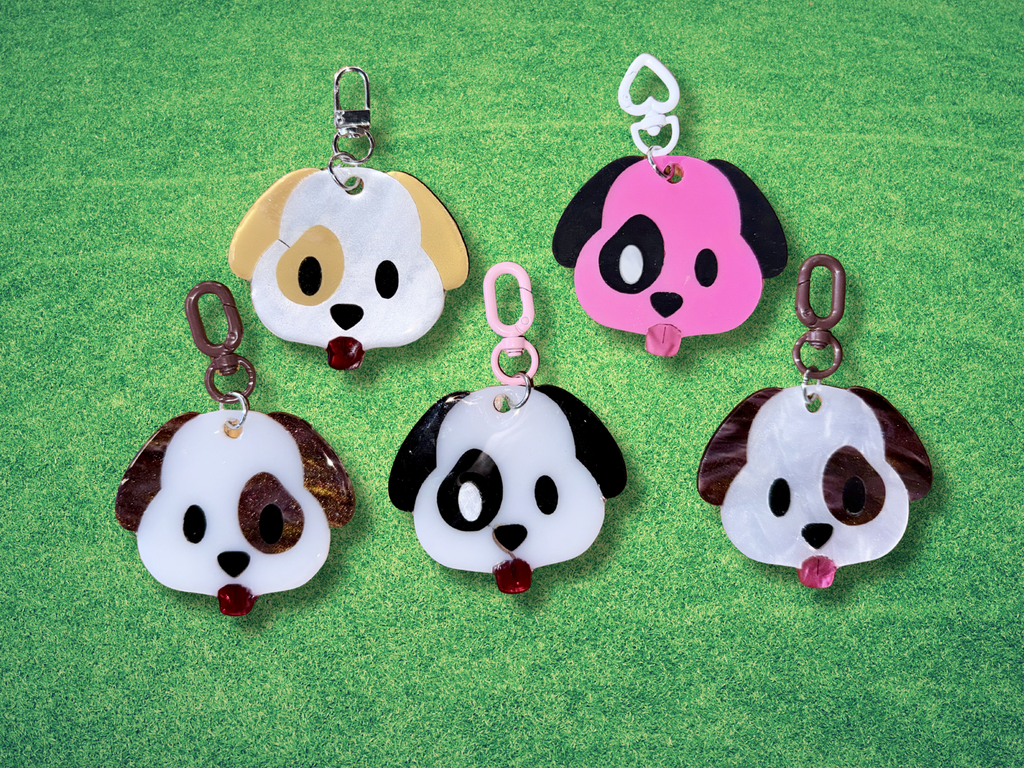 Colorful Adorrible Emoji Dog Keychain featuring a playful dog face with expressive emoji-style eyes and a vibrant design.
