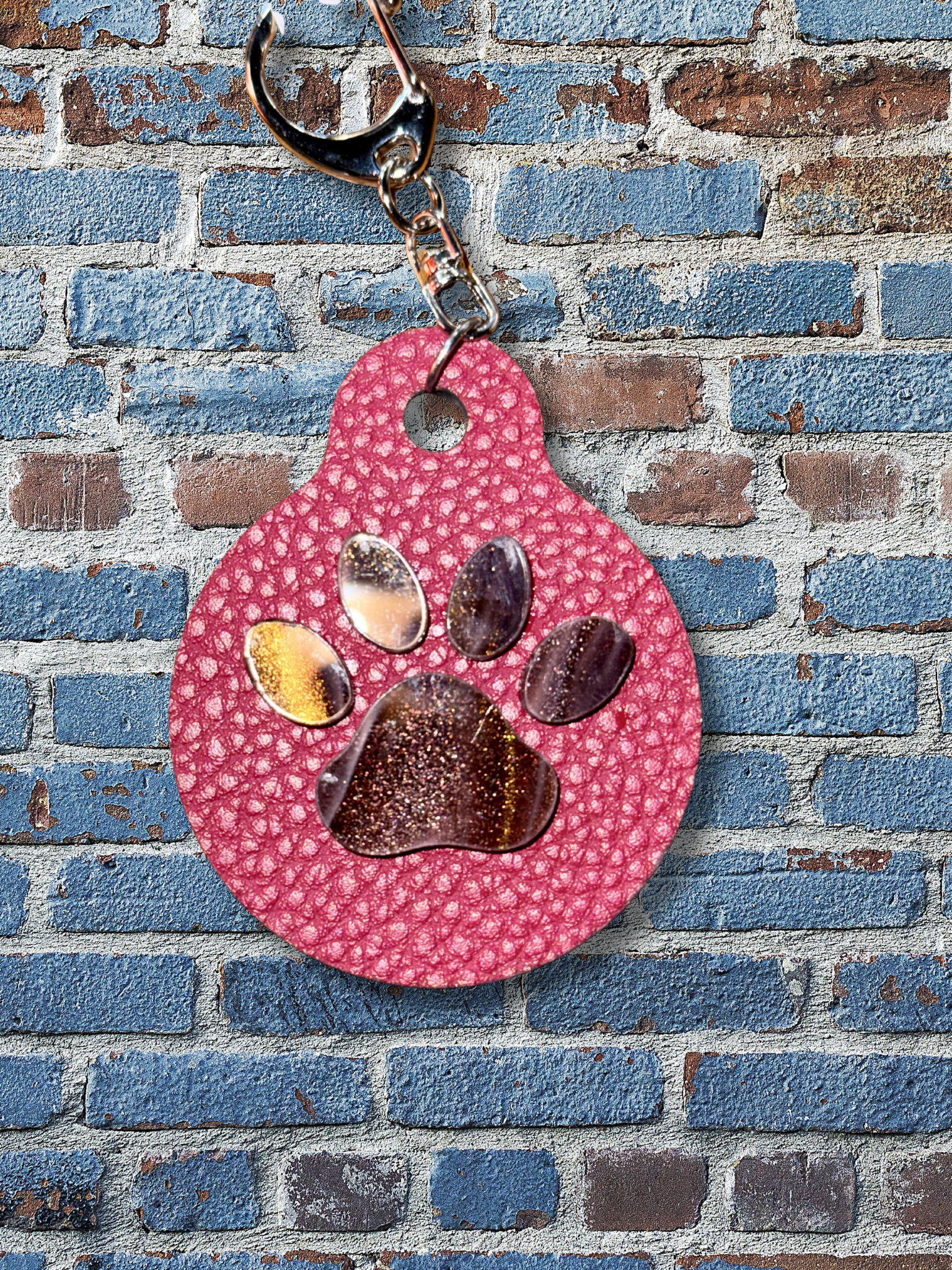 Adorrible paw keychain featuring a cute, detailed paw print design on a metal keyring.