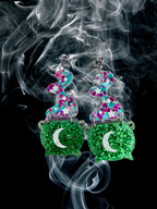 Adorrible Witch’s Cauldron Earrings featuring small black cauldrons with fiery orange accents, perfect for witch-themed accessories.