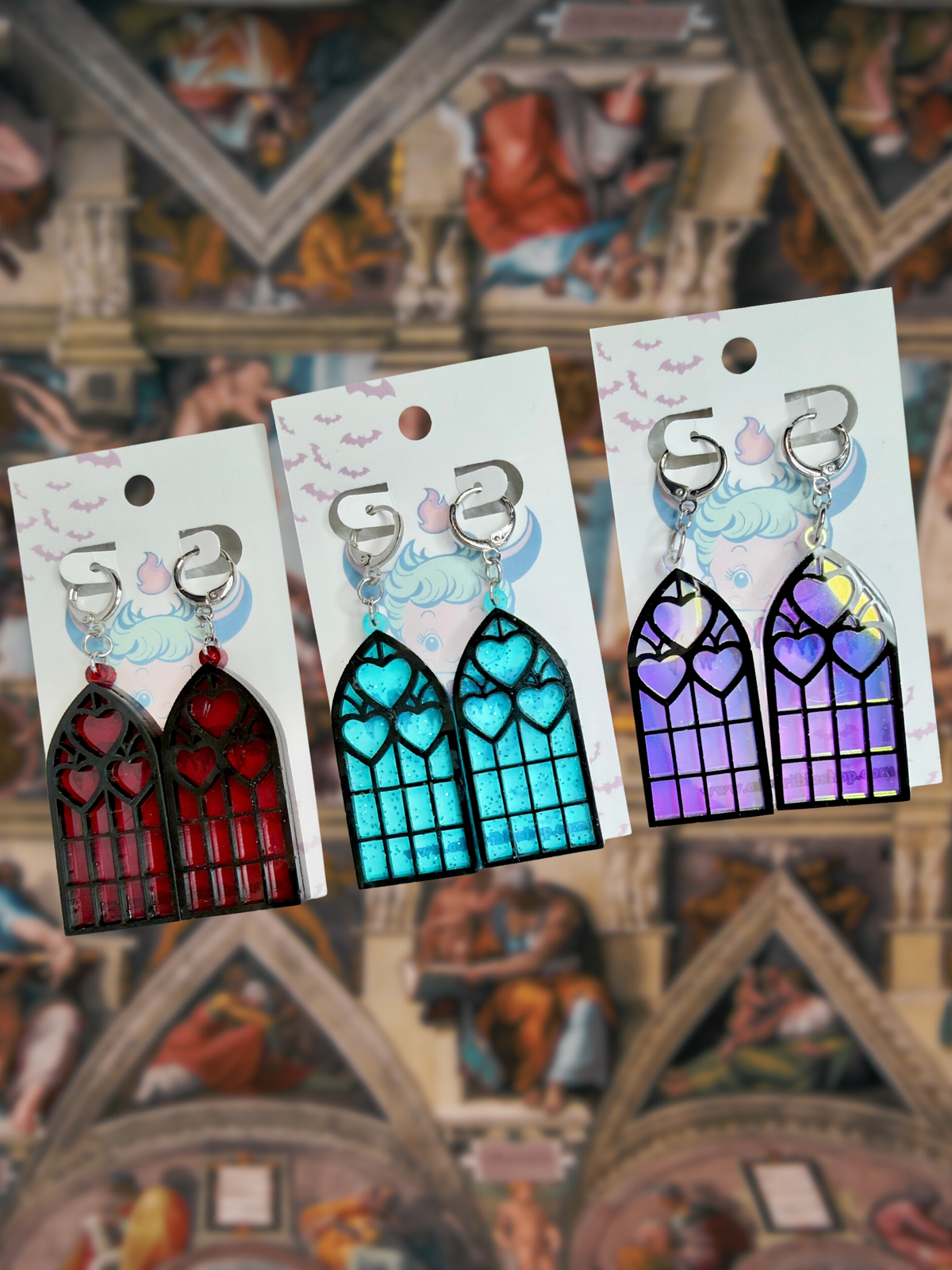 Adorrible Cathedral of Love acrylic dangle earrings featuring colorful, abstract design with a modern, artistic style.