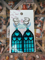 Adorrible Cathedral of Love acrylic dangle earrings with intricate design and vibrant colors, hanging from silver hooks.