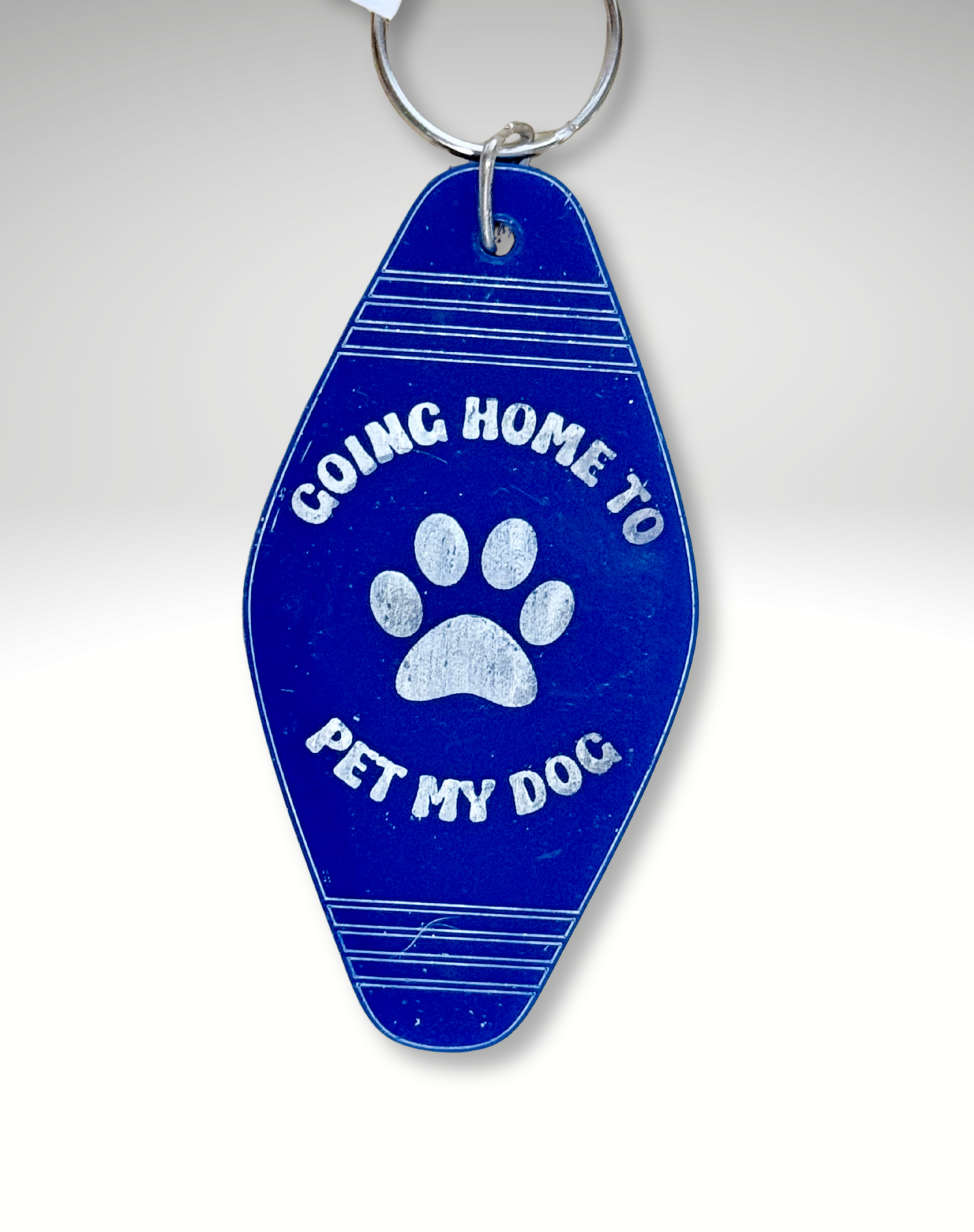 Adorrible dog lover motel keychain featuring a cute dog design on a metal keyring. Perfect for pet enthusiasts.