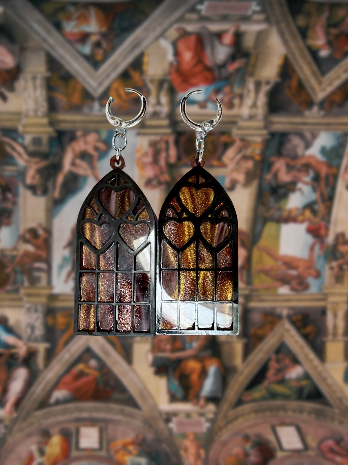 Adorrible Cathedral of Love acrylic dangle earrings featuring colorful, geometric design with gold-tone hooks.