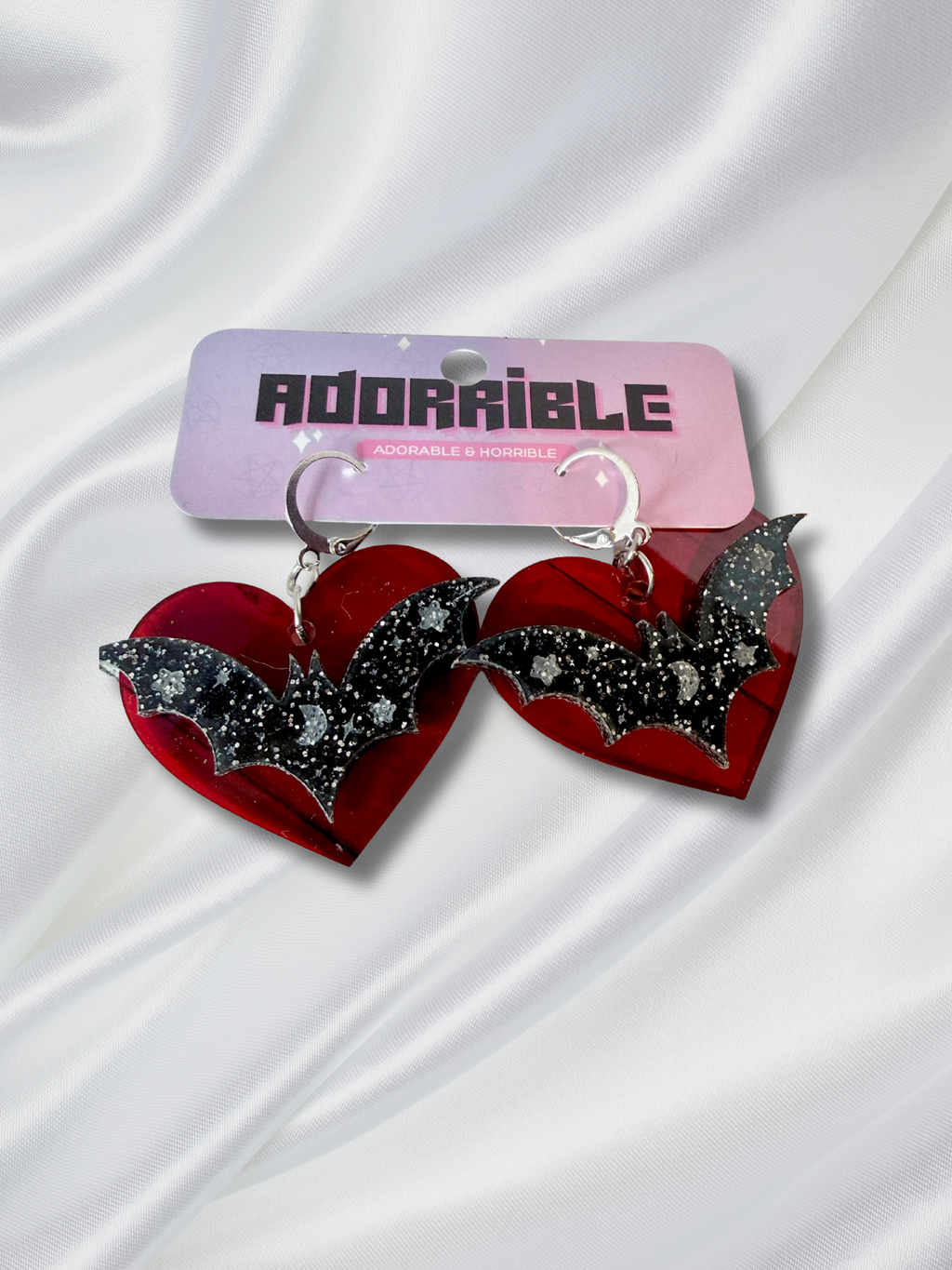 Adorrible Batty Heart earrings featuring black bat-shaped design with heart accents, stylish jewelry for various occasions.
