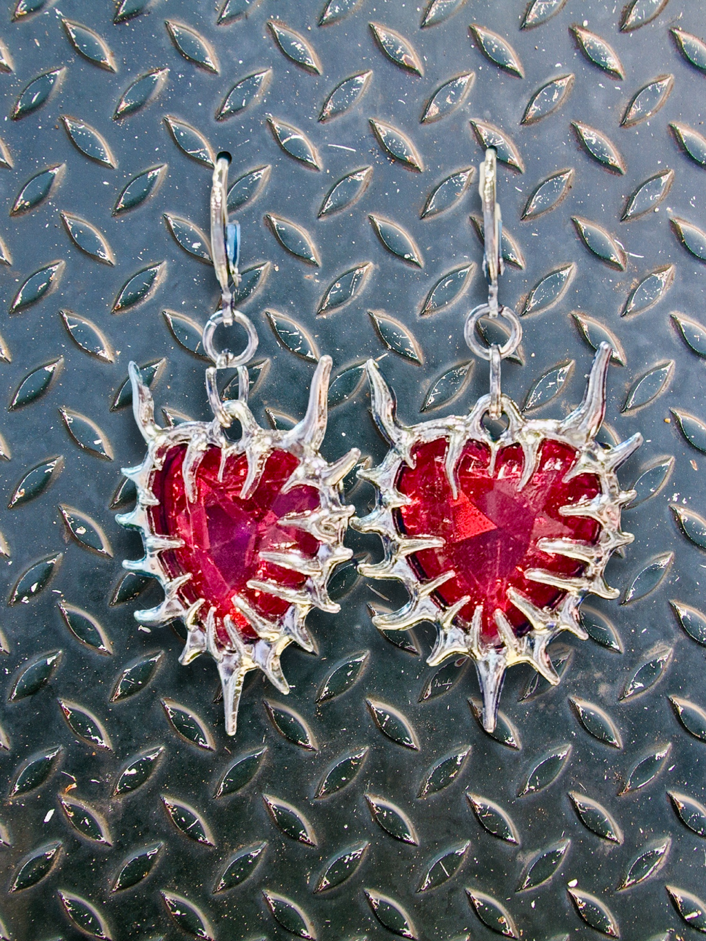 Adorrible Thorny Heart Gem Earrings featuring gold-tone earrings with intricate heart-shaped designs and sparkling gem accents.