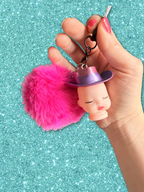 Adorrible Pride cowboy hat baby doll head keychain with colorful hat and detailed facial features, ideal for accessories.