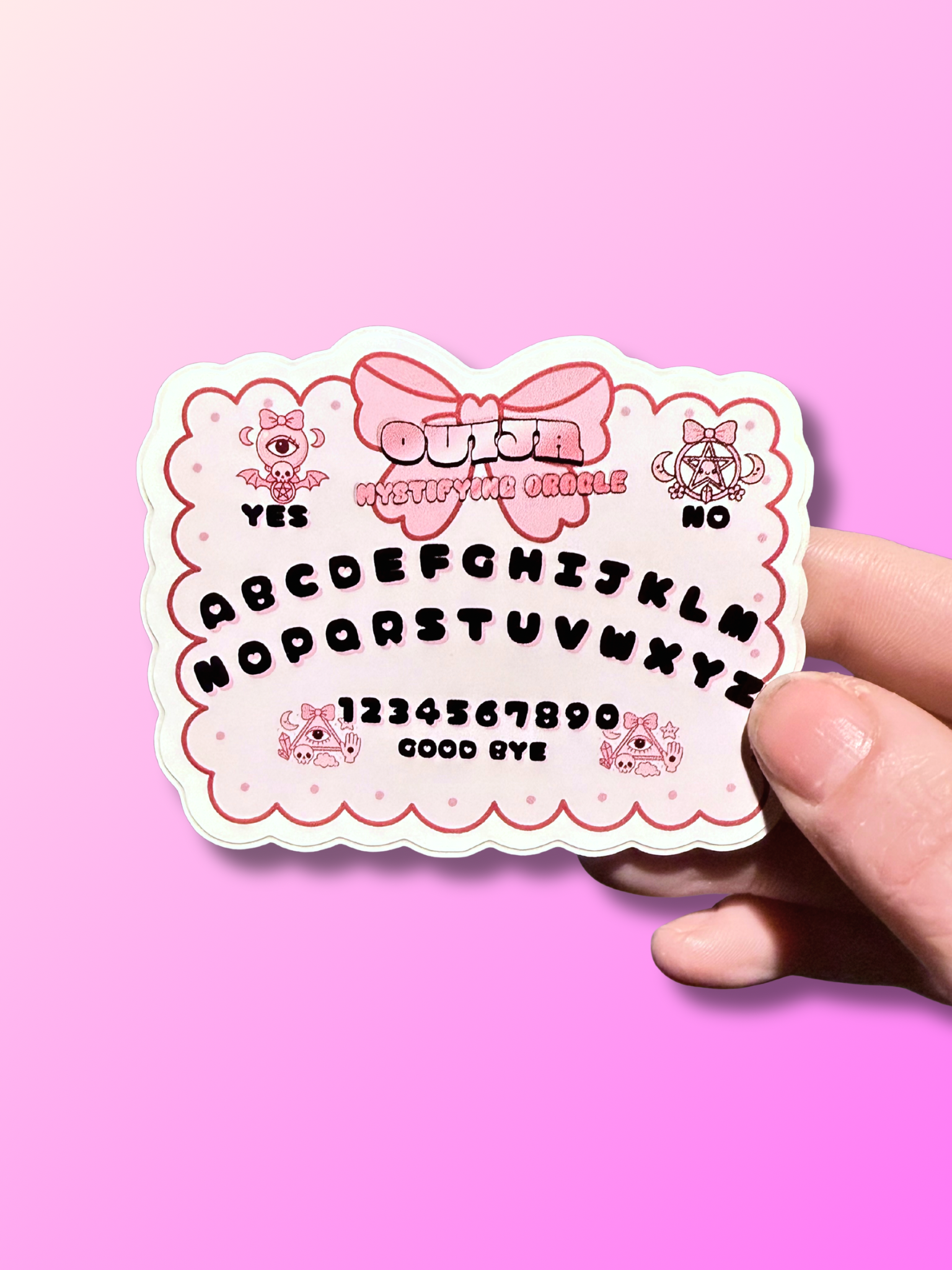 Kawaii Ouija Board sticker by Adorrible featuring cute ghost and spooky symbols on a black background.