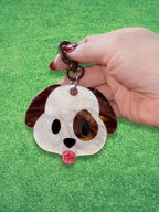 Colorful Adorrible emoji dog keychain featuring a cute cartoon dog face with expressive emoji eyes and a metal keyring.