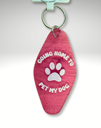 Adorrible dog lover motel keychain with a cute dog illustration and metal keyring on a white background.