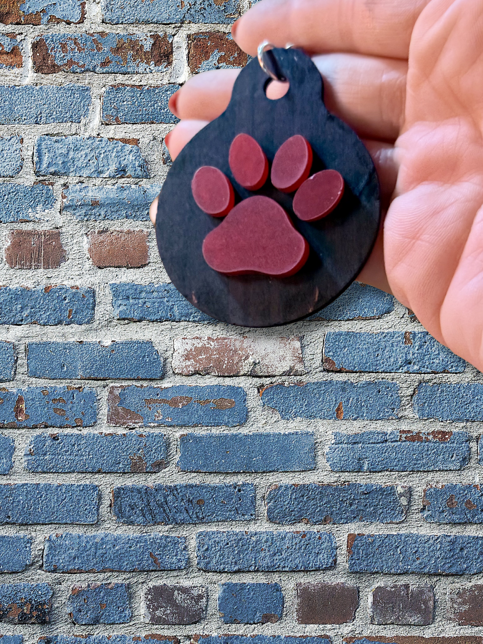 Adorrible paw-shaped keychain with metal ring, featuring a cute, detailed paw print design for pet lovers and accessories enthusiasts.