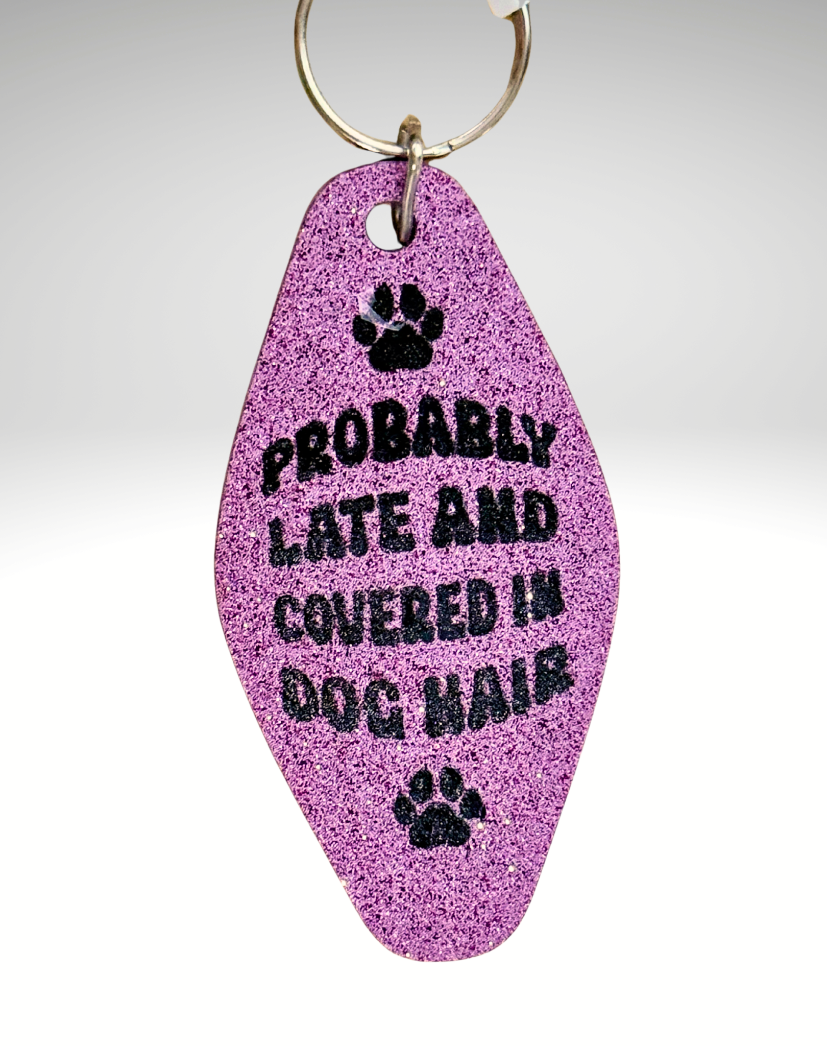 Adorrible Dog Lover Motel keychain featuring a dog-themed design with a metal chain and clasp.