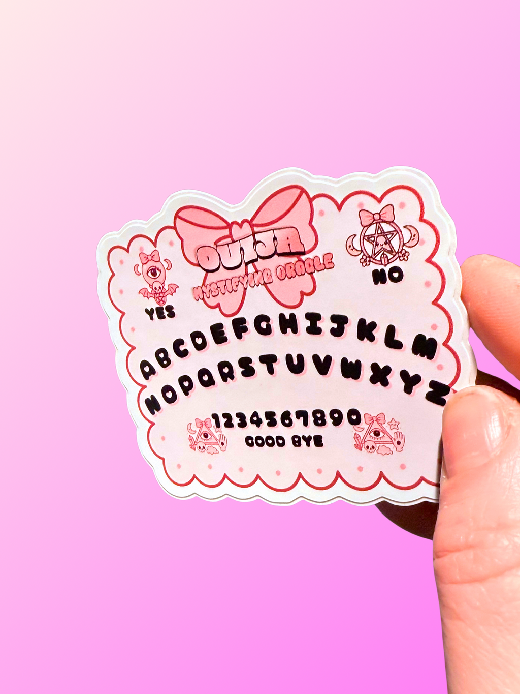 Colorful kawaii Ouija board sticker by Adorrible featuring cute ghost and mystical symbols on a white background.