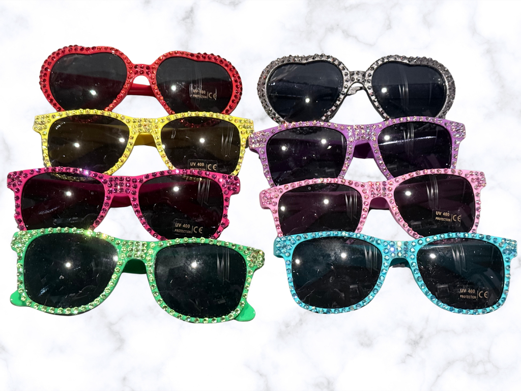 Stylish Adorrible rhinestones sunglasses with sparkling accents and dark tinted lenses, perfect for fashion-forward looks.