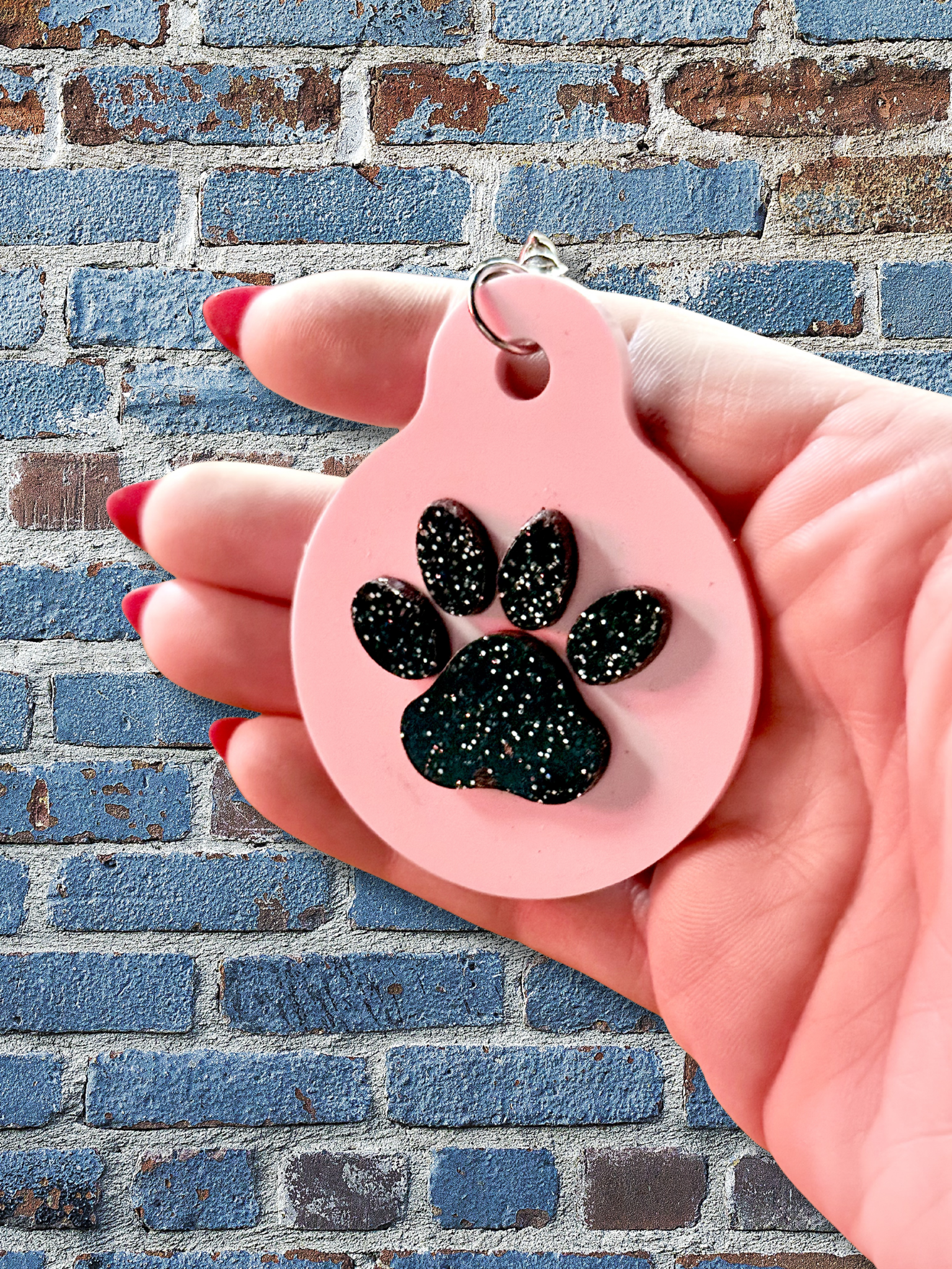 Adorrible paw keychain with a cute, detailed paw print design on a metal keyring, perfect for keys or bags.