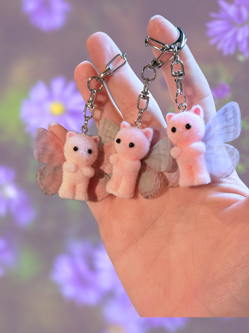 Adorrible butterfly wing cat keychain featuring colorful, detailed butterfly wings attached to a metal keyring, perfect for accessories.