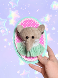 Adorrible plushie mounted taxidermy wall hanging featuring a soft, plush animal figure with realistic details on a wooden plaque.