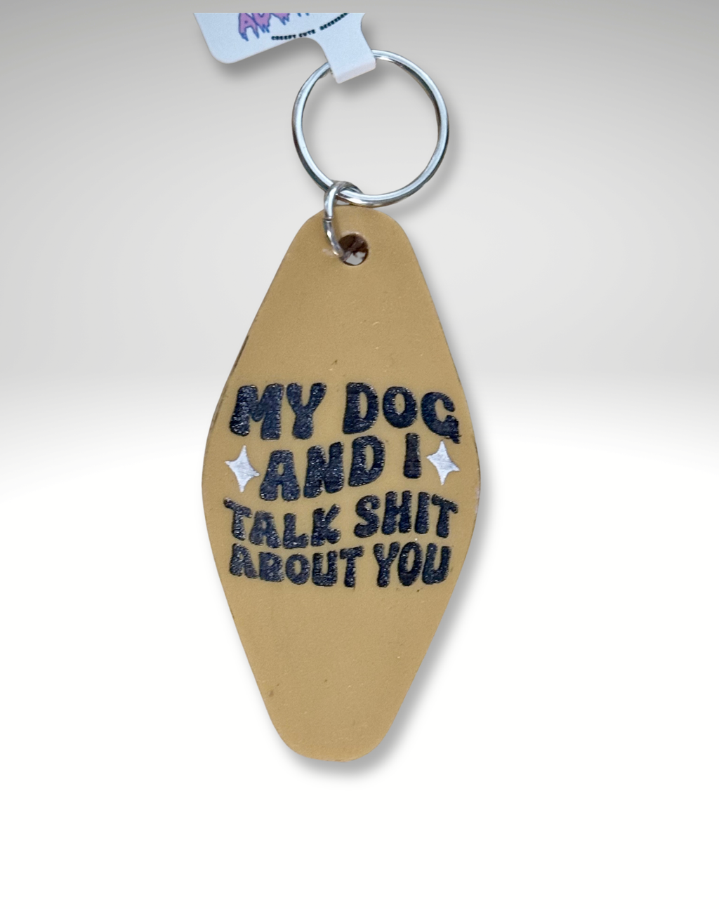 Adorrible Dog Lover Motel keychain featuring a cute dog illustration on a metal ring, perfect for pet enthusiasts.