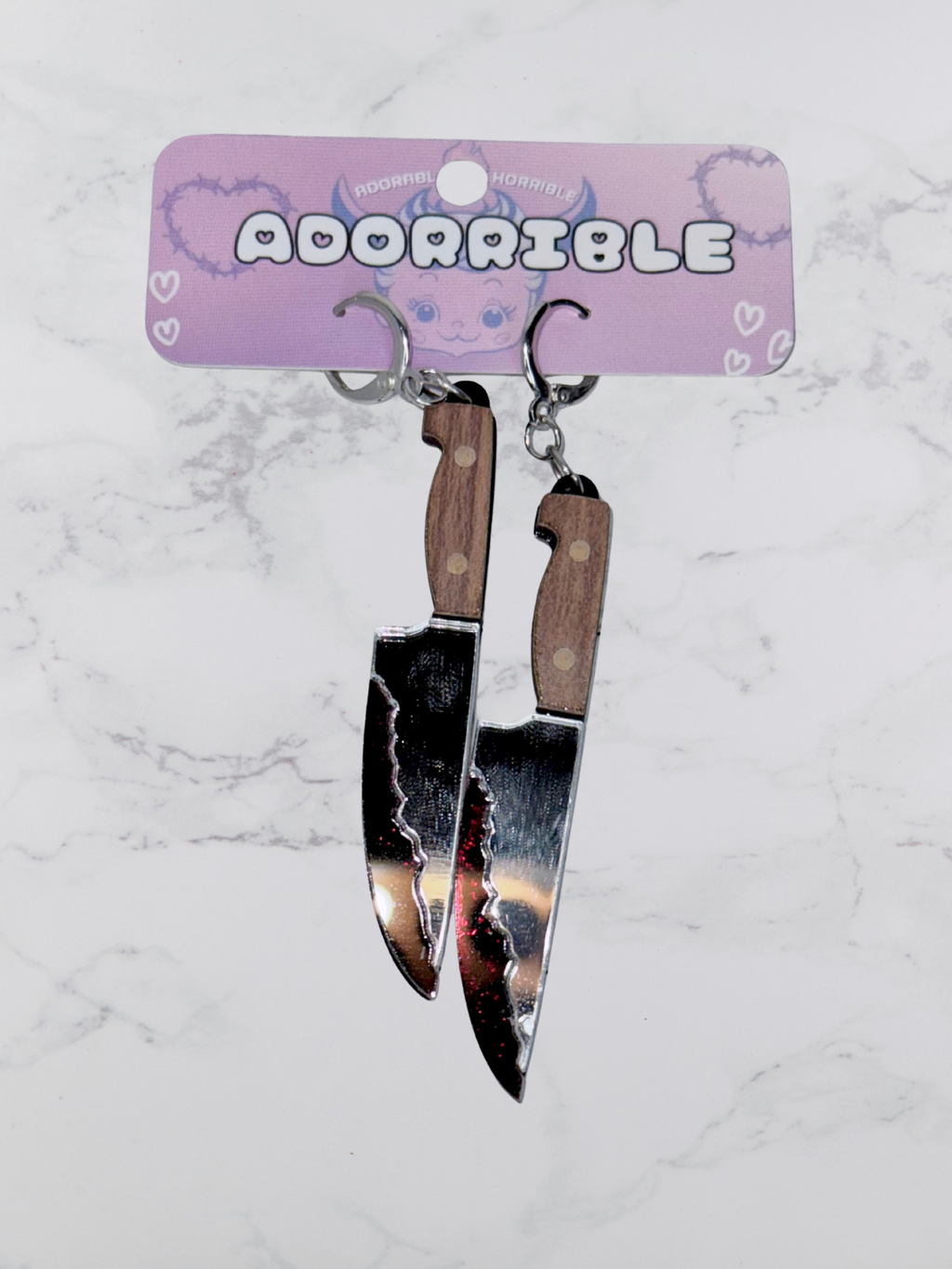 Layered Bloody Knife Dangle Earrings by Adorrible, featuring dagger-shaped earrings with layered, edgy bloody knife designs.