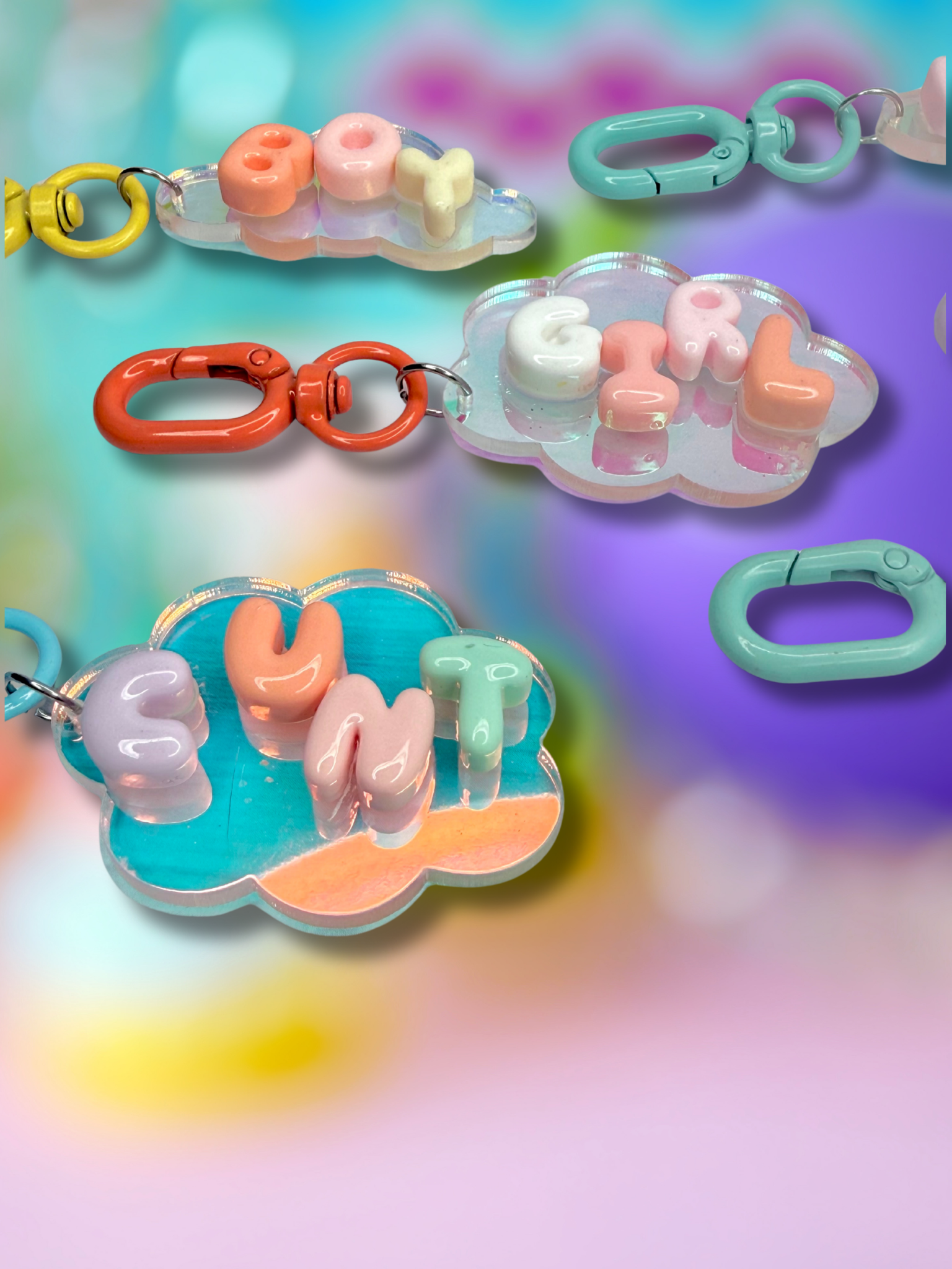 Iridescent cloud-shaped bubble letter keychain by Adorrible with shiny, colorful finish on a silver keyring.