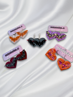 Adorrible Batty Heart earrings featuring black bat and heart design, silver hooks, perfect for gothic or Halloween-themed accessories.