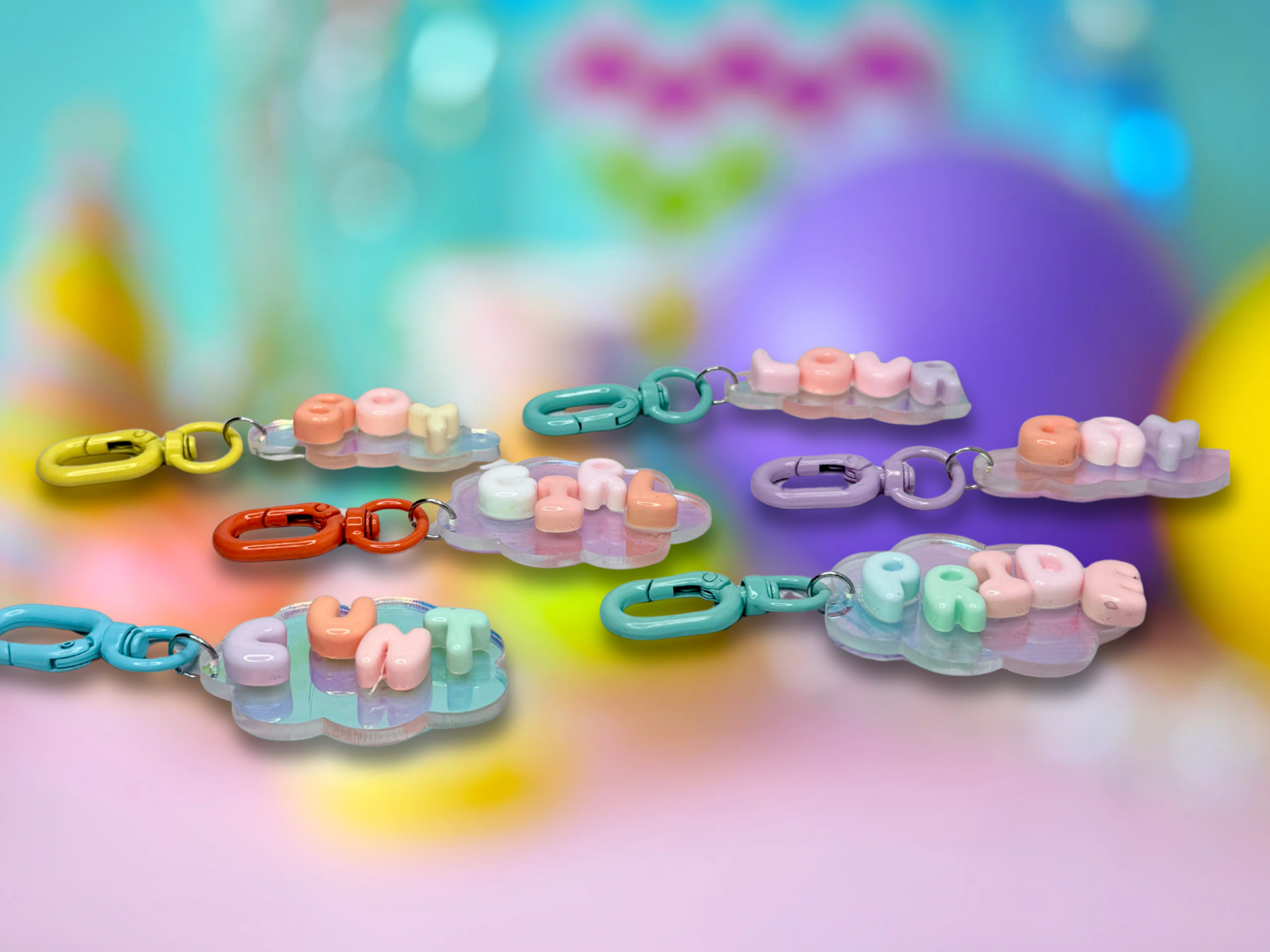 Iridescent cloud-shaped keychain with bubble letter design from Adorrible, featuring shiny, colorful accents.