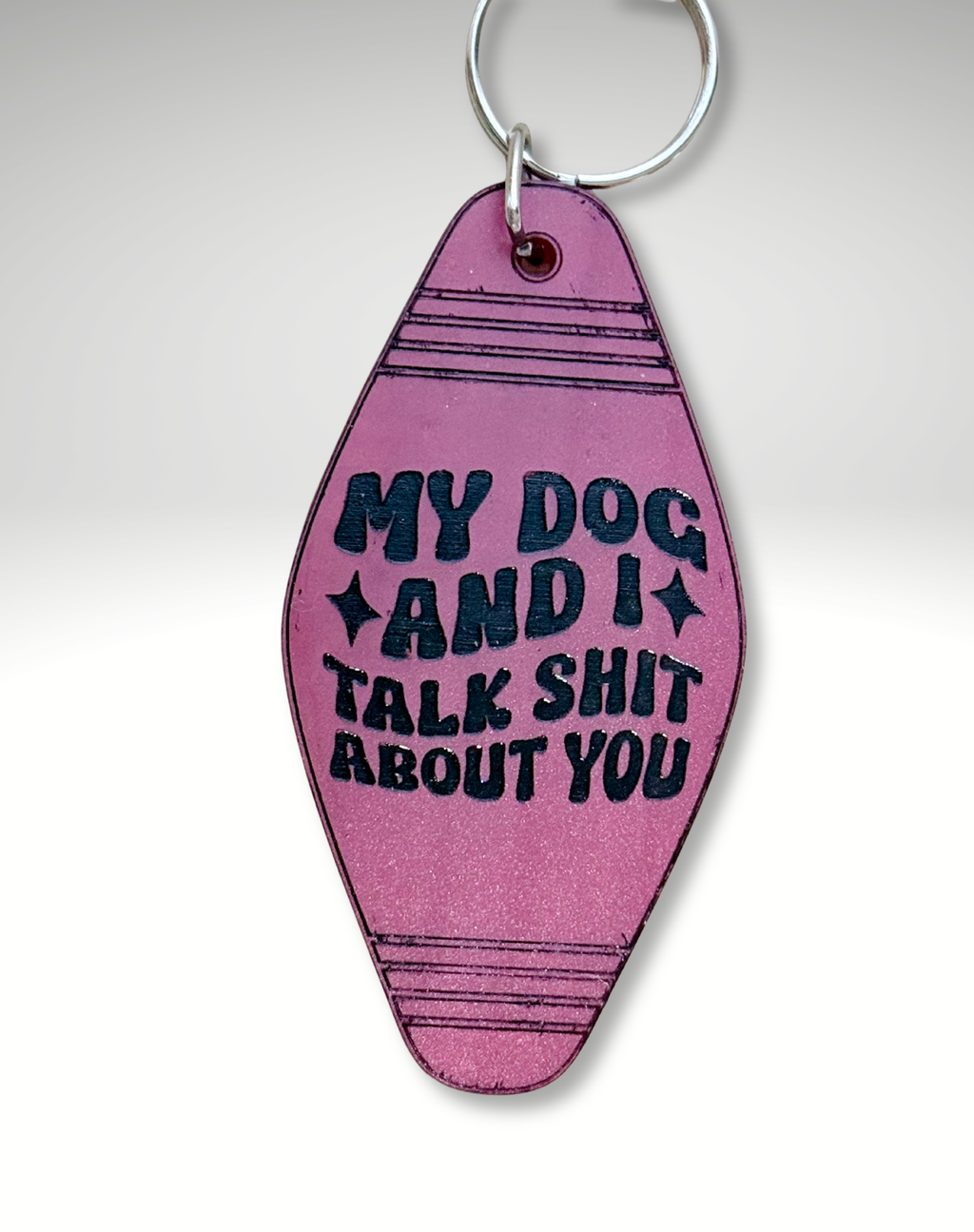 Adorrible Dog Lover Motel keychain featuring a cute dog illustration on a metal keyring.