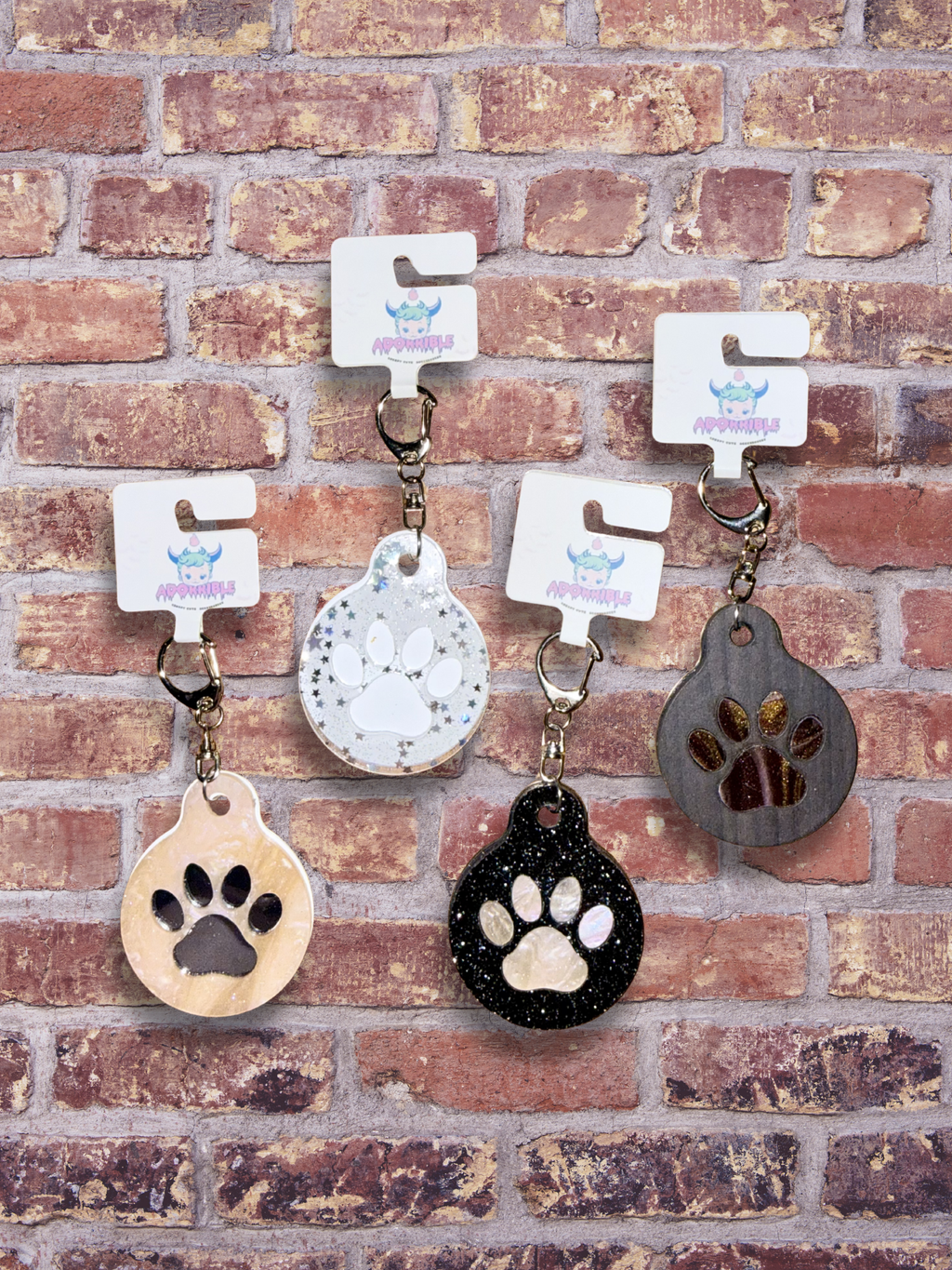 Adorrible paw-shaped keychain with a cute, detailed design, perfect for attaching to keys or bags.