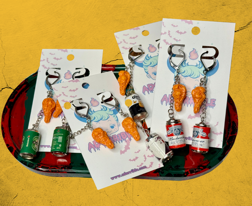 Quirky chicken earrings paired perfectly with a refreshing beer for fun and unique style