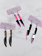 Layered Bloody Knife Dangle Earrings by Adorrible featuring dagger-shaped design with blood-spattered details