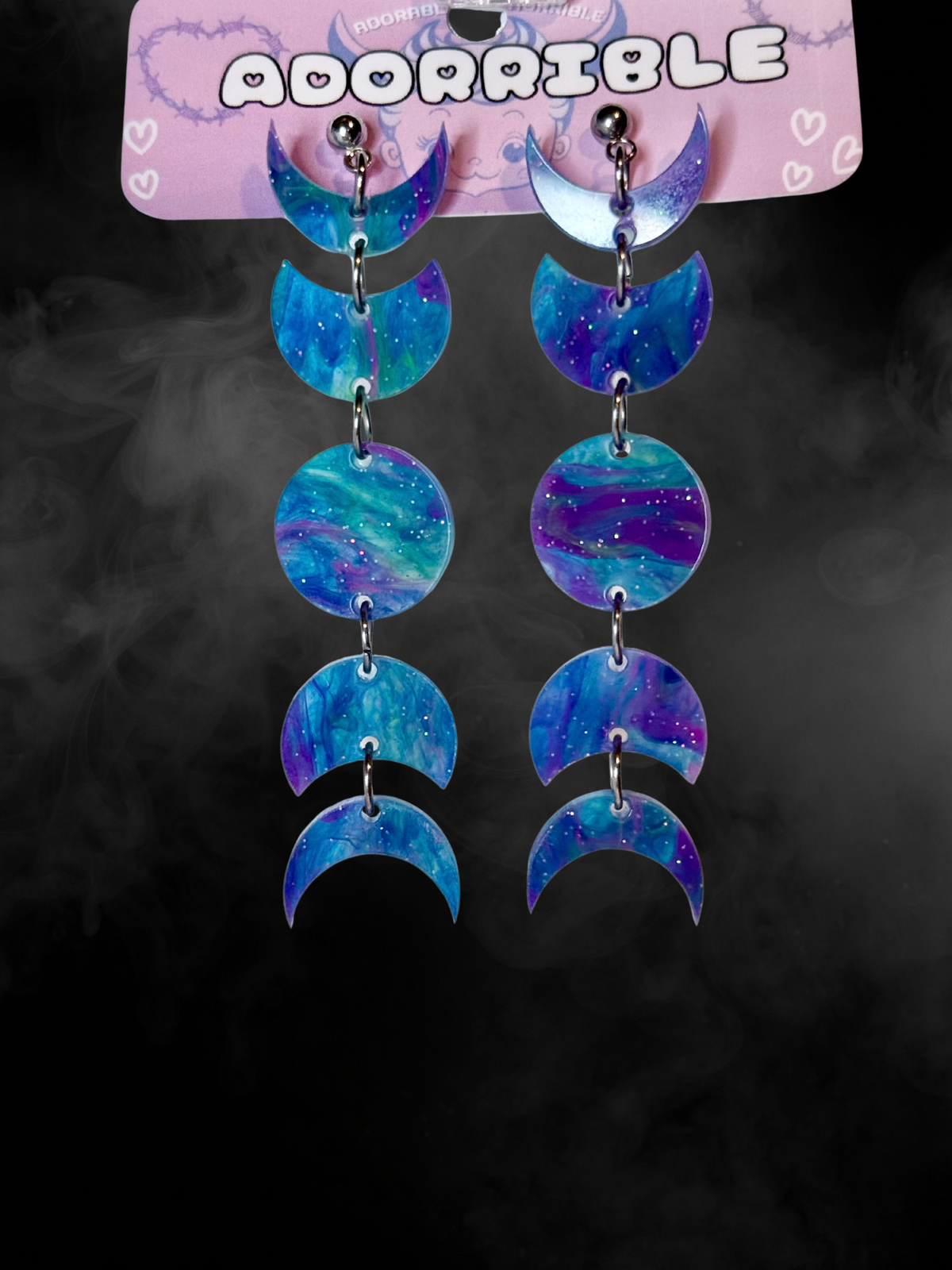 Adorrible Moon Phases earrings featuring silver crescent and full moon designs on elegant hooks.