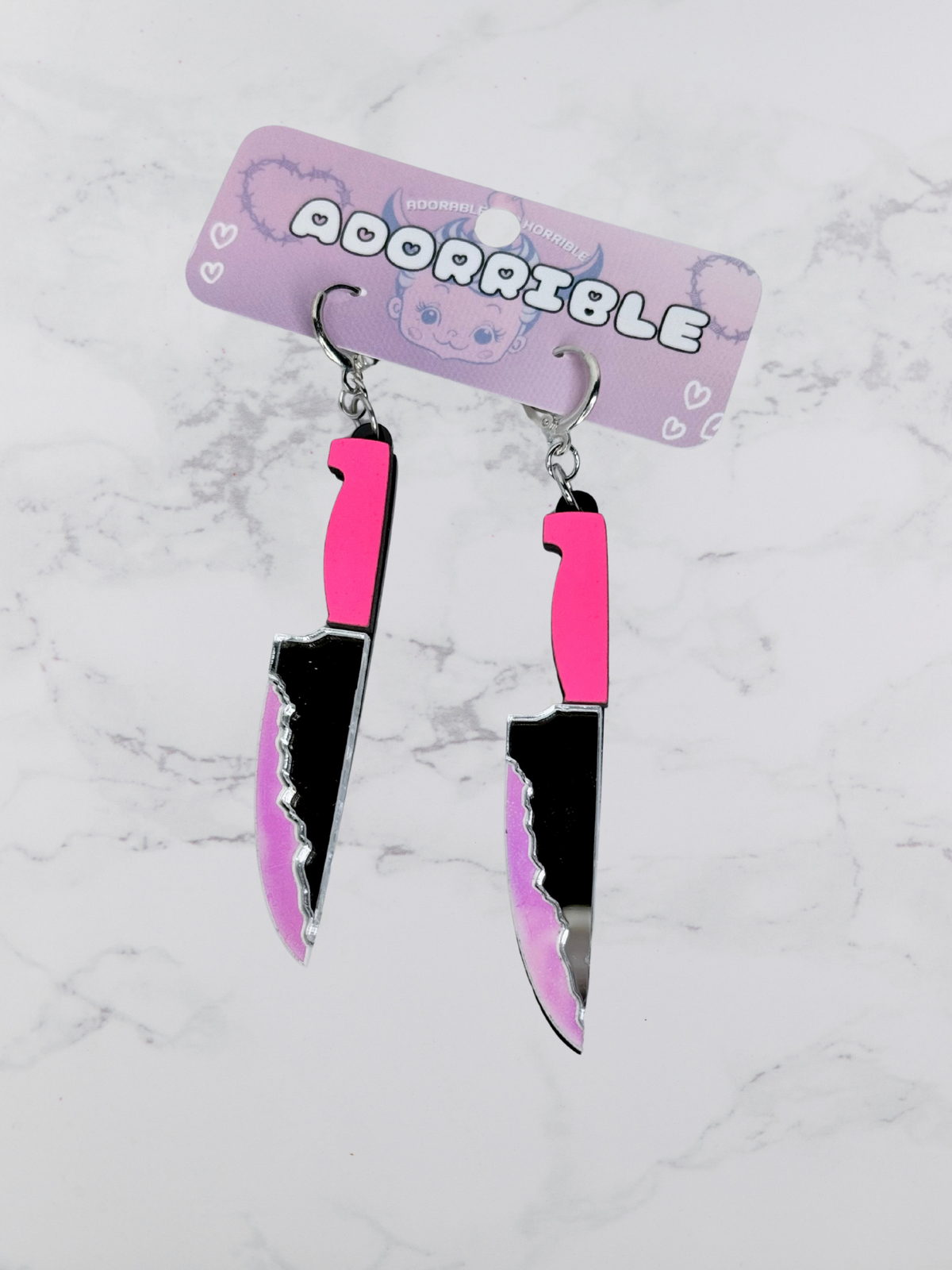 Layered bloody knife dangle earrings by Adorrible featuring dagger-shaped earrings with layered design and dark, edgy style.