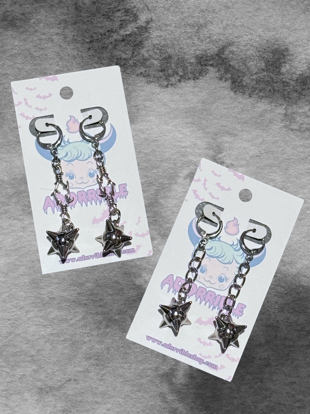 Adorrible metal mace dangle earrings with intricate design and hoop attachments, stylish jewelry accessory for women.