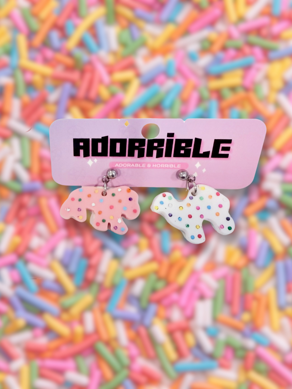 Adorrible animal cookies dangle earrings featuring colorful cookie-shaped charms on silver hooks.