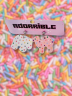 Adorrible animal cookies dangle earrings featuring colorful cookie-shaped charms hanging from silver hooks.