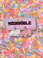 Adorrible animal cookies dangle earrings featuring colorful cookie-shaped charms hanging from silver hooks.