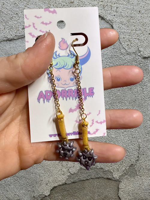 Handcrafted clay earrings inspired by the intricate beauty of a mace, perfect for unique style and charm