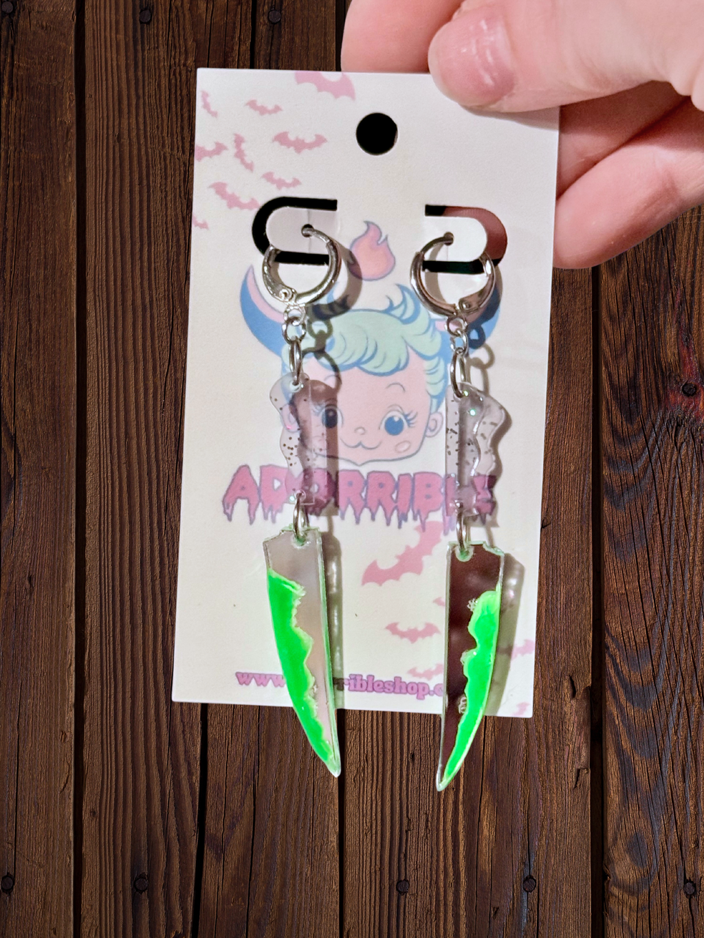 Adorrible two-part bloody knife earrings with detailed silver-tone blades and blood-red accents, stylish and edgy jewelry.