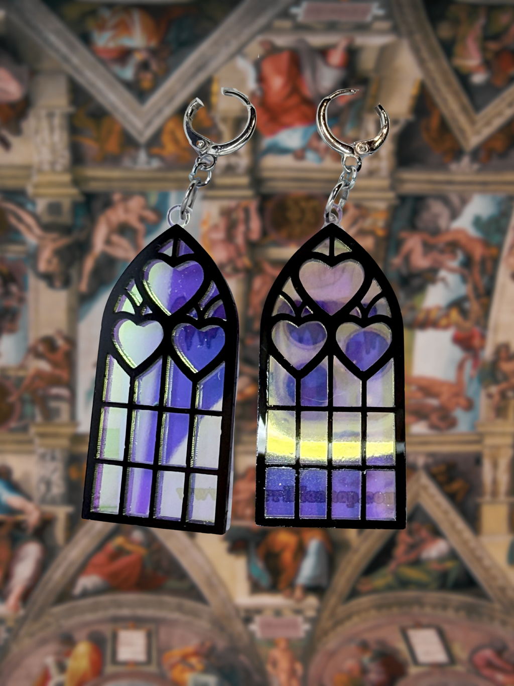Adorrible Cathedral of Love acrylic dangle earrings featuring vibrant, artistic design with floral and religious motifs.