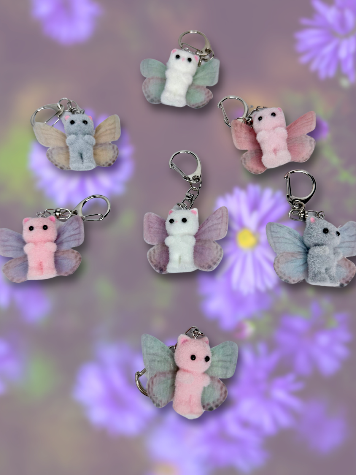 Adorrible butterfly wing cat keychain featuring colorful butterfly and cat design on a metal keyring.