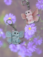 Adorrible butterfly wing cat keychain featuring colorful, detailed butterfly wings and a cute cat charm attached.
