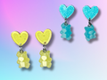 Electrified gummi bear earrings featuring a skeleton design, perfect for bold and quirky jewelry lovers.