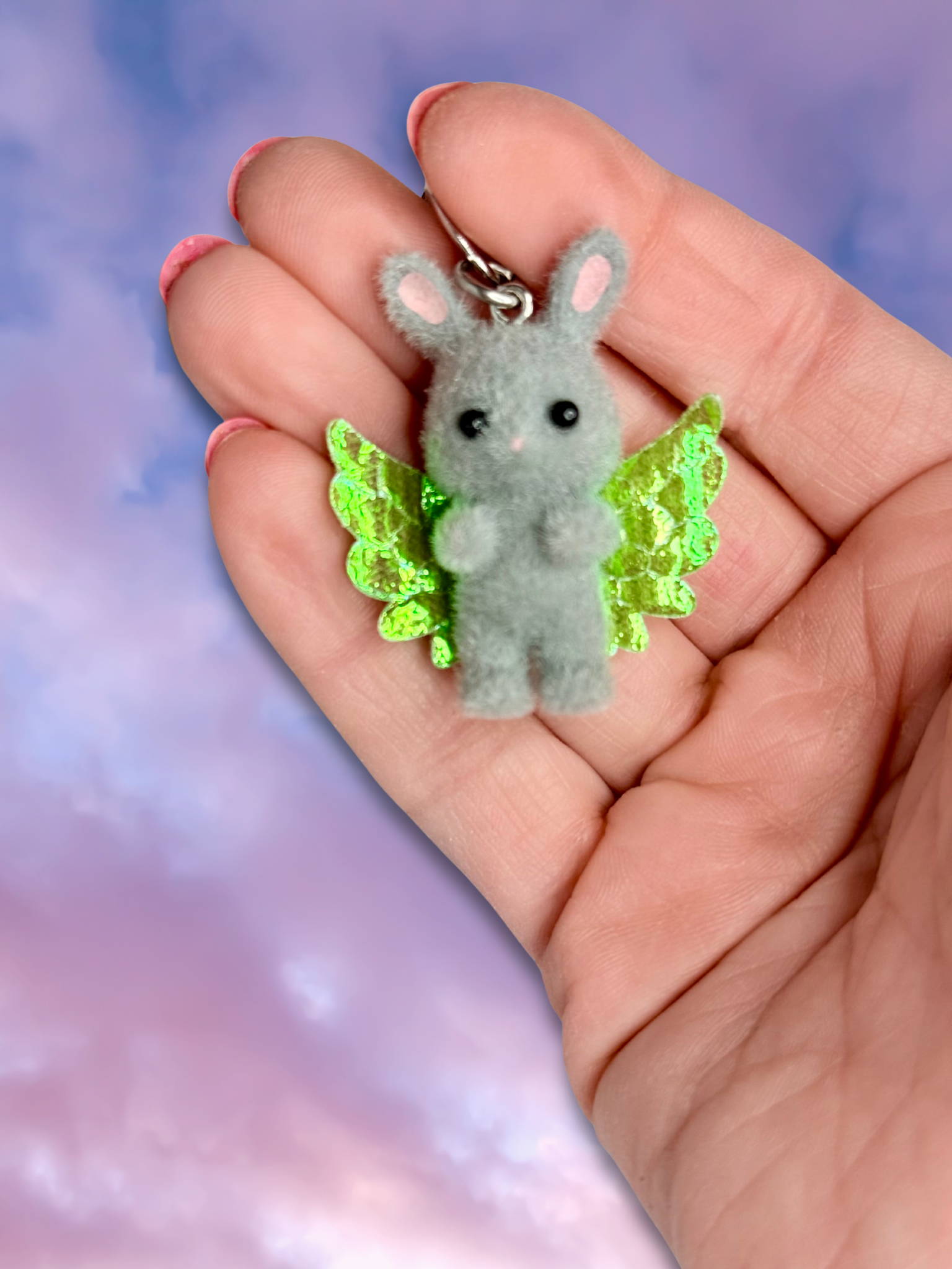 Adorrible Cupid Cuties animal keychain with wings, featuring colorful, cute winged animal charms on a silver keyring.