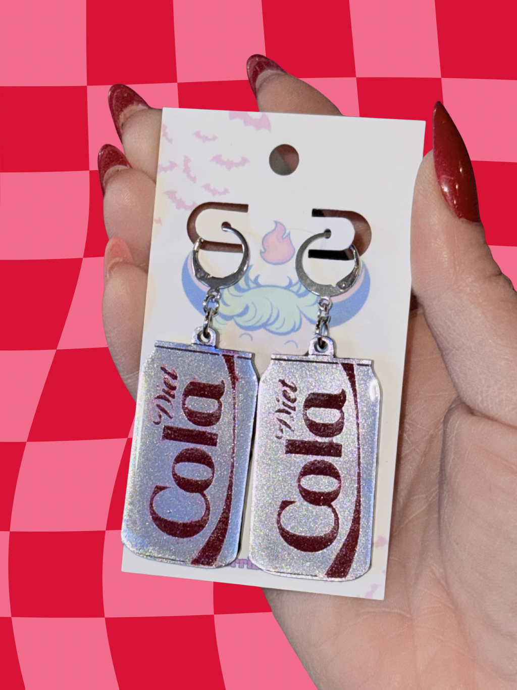 Adorrible Diet Cola earrings featuring miniature cola bottle charms, silver-toned metal dangle earrings for a fun, quirky style.