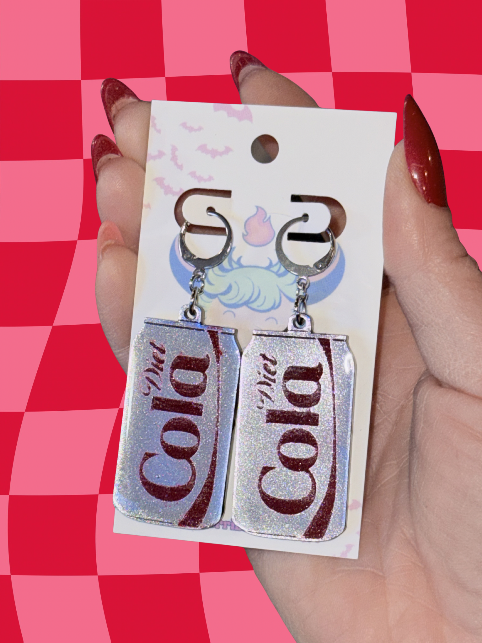 Adorrible Diet Cola earrings featuring miniature cola bottle charms, silver-toned metal dangle earrings for a fun, quirky style.
