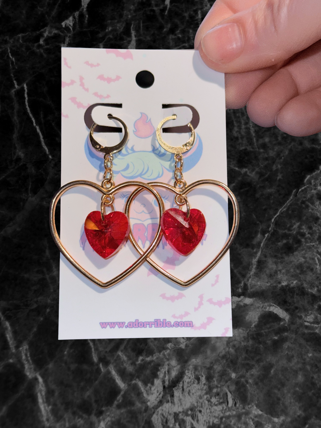 Adorrible heart-shaped hoop earrings with sparkling heart crystals, elegant jewelry for stylish accessories.