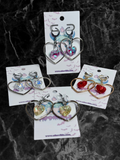 Adorrible heart-shaped hoop earrings with sparkling heart crystals, stylish jewelry for elegant occasions.