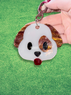Colorful emoji dog keychains by Adorrible featuring playful cartoon dog faces and vibrant designs.