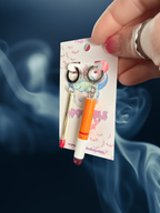 Adorrible mismatched cigarette and match earrings, stylish dangle earrings with unique matchstick and cigarette designs.